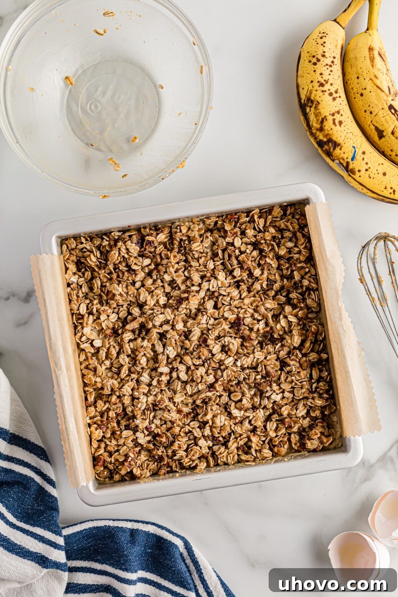 Overhead view of banana oatmeal crumb cake in pan