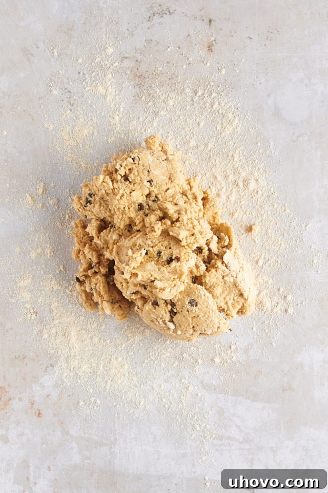 Overhead view of scone dough turned out onto a lightly floured work surface.