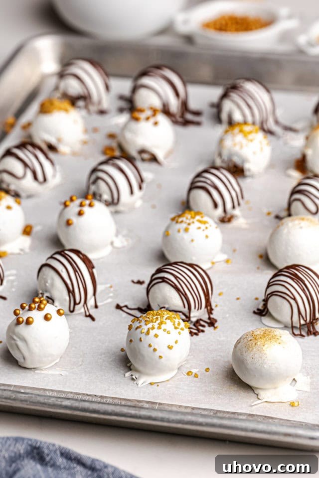 Gingerbread truffles carefully placed on a baking sheet, allowing the chocolate coating to fully set and harden in the refrigerator.