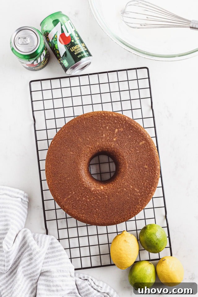 Overhead view of an inverted 7UP cake cooling completely on a wire rack.