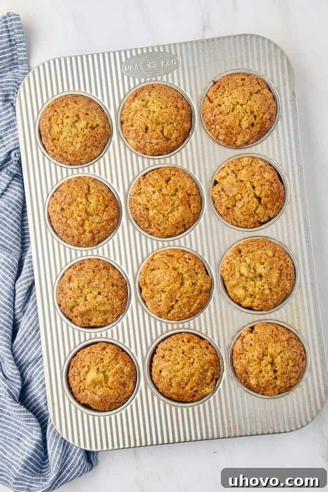 overhead view of freshly baked banana bread muffins in a muffin pan