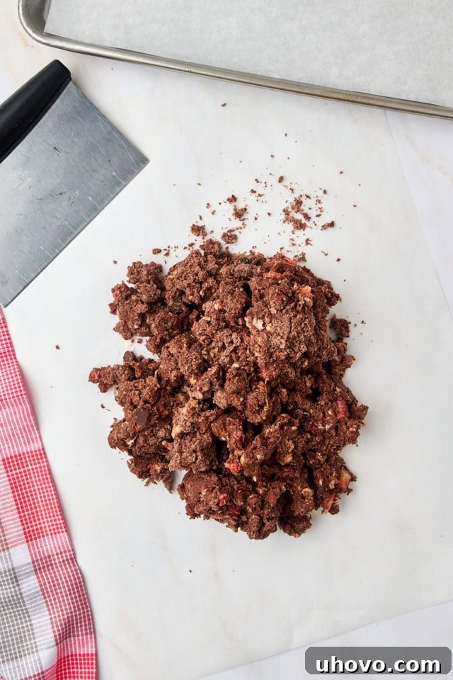 Overhead view of the chocolate strawberry scone dough transferred onto a lightly floured surface.