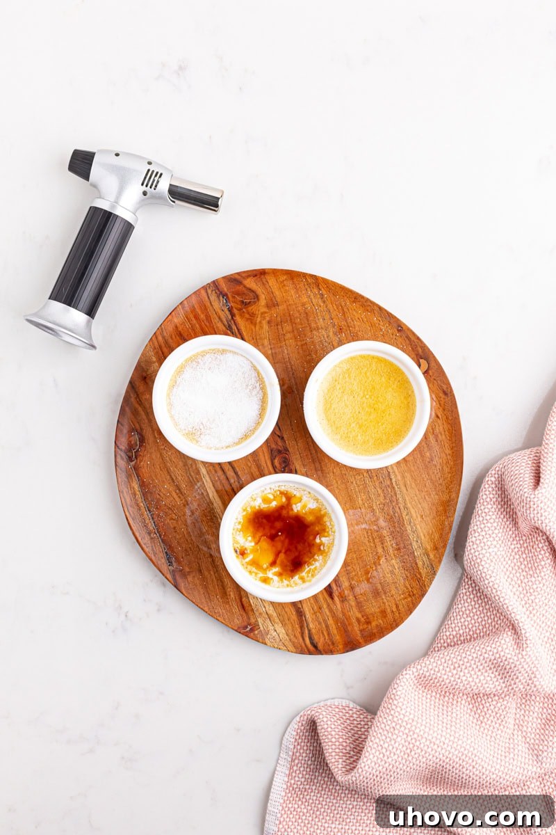 An overhead view demonstrating the three stages of crème brûlée: one with a pristine caramelized sugar top, one with just a layer of white sugar, and one plain custard.