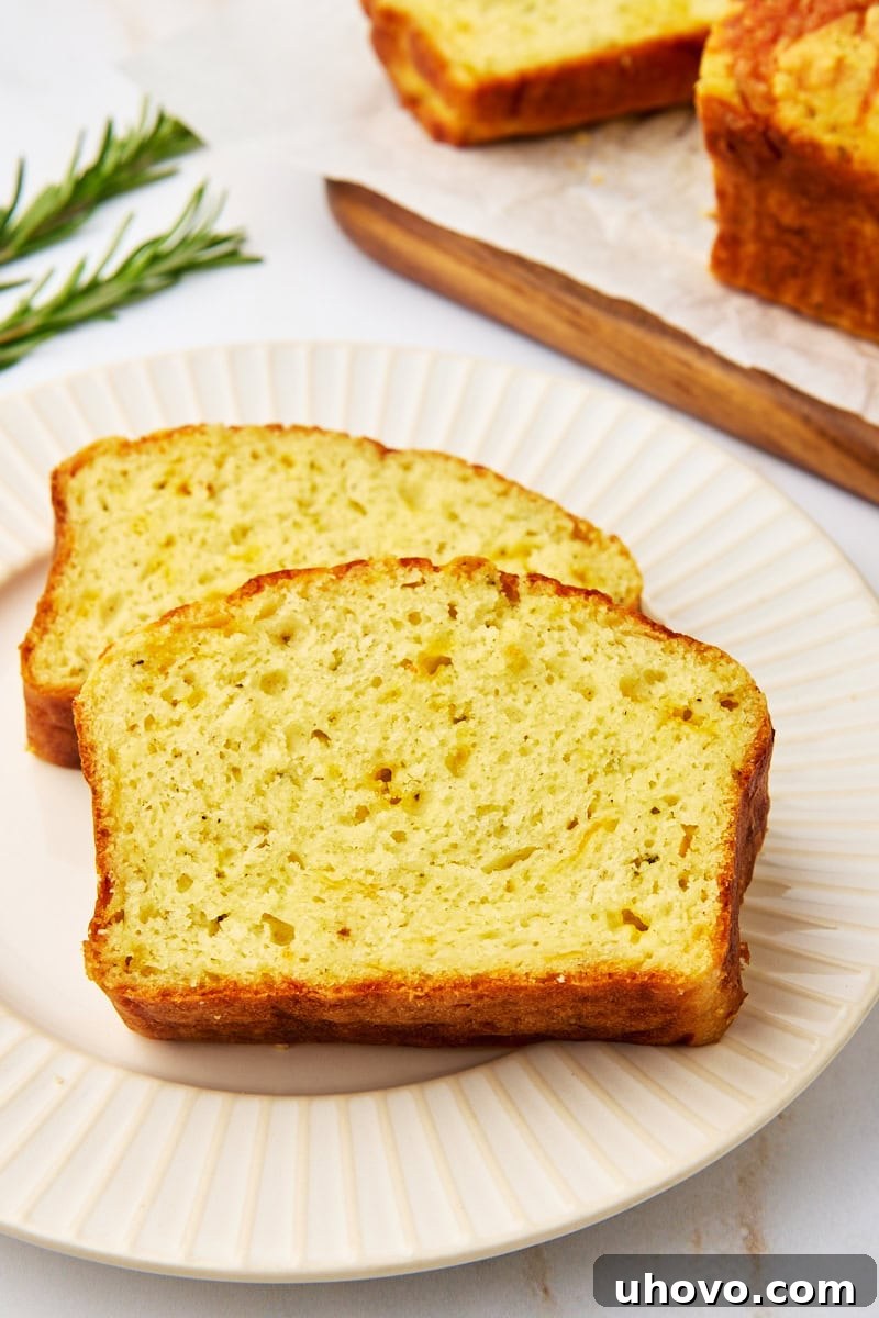 two slices of herb and cheese quick bread on a plate