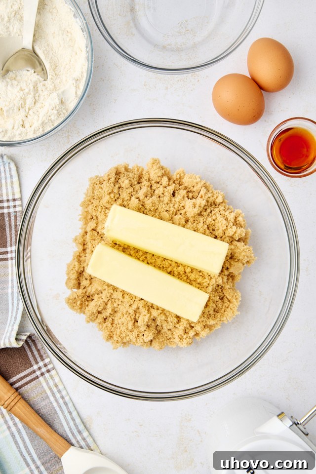 overhead view of butter and brown sugar in a mixing bowl