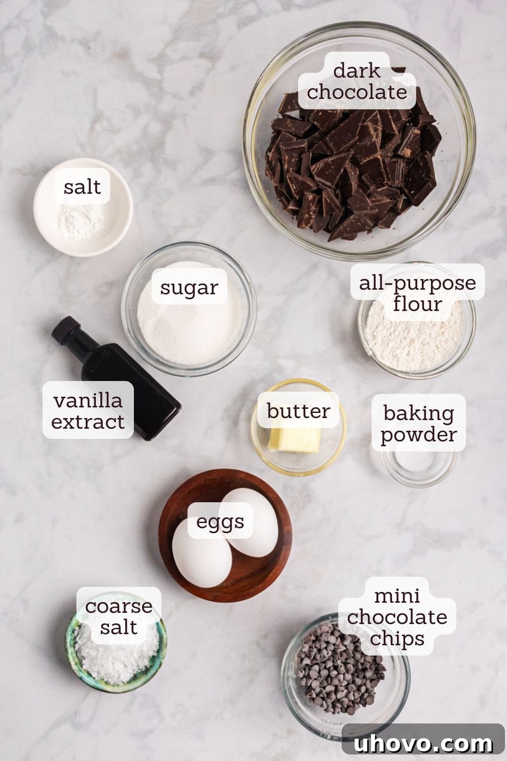 An overhead view showcasing the essential ingredients laid out meticulously for making salted chocolate truffle cookies, highlighting their quality and freshness.