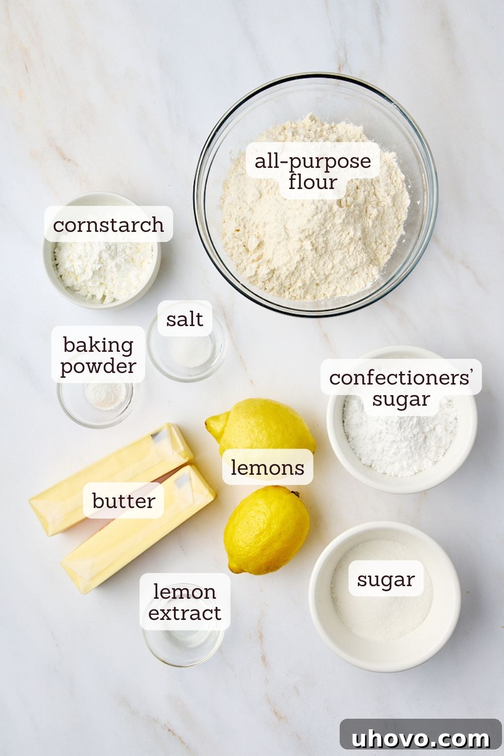 An overhead view of essential ingredients for crafting lemon cooler cookies, beautifully arranged on a countertop.