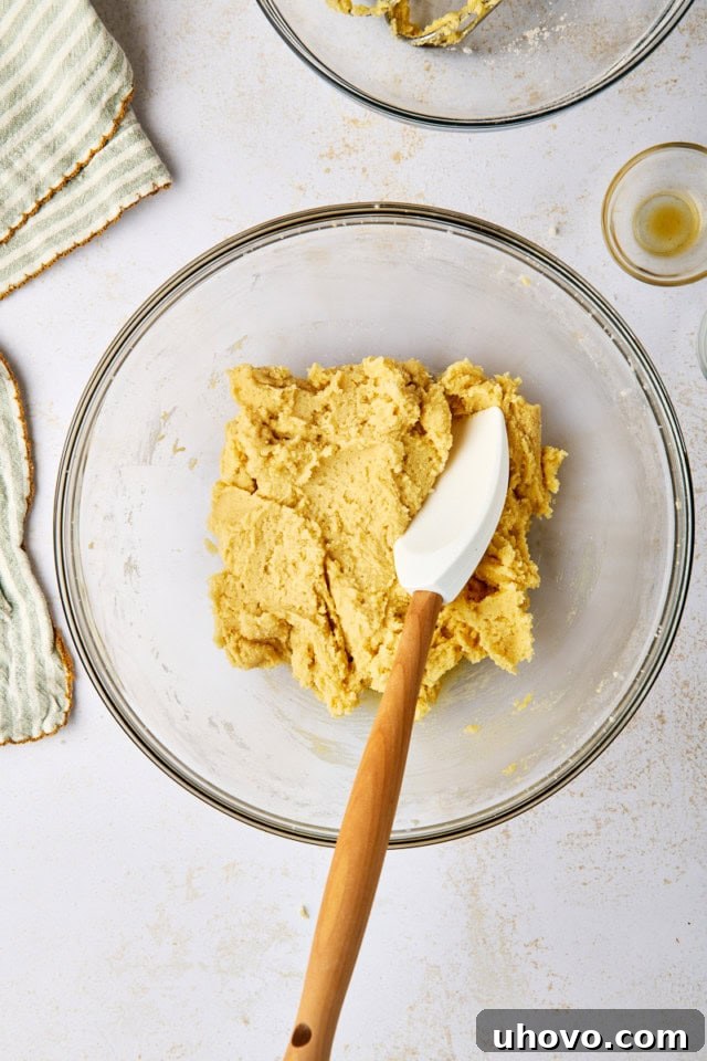 overhead view of sugar cookie dough in a glass mixing bowl