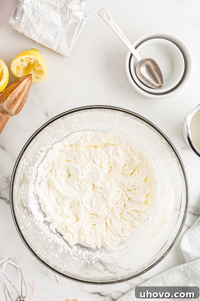 Overhead view of whipped cream in mixing bowl