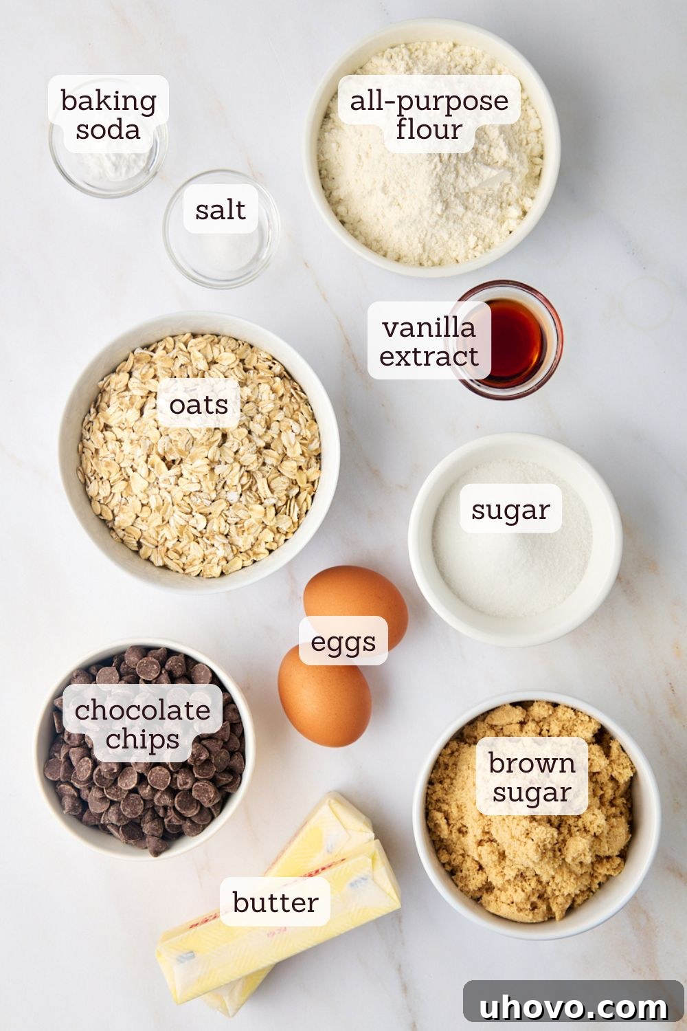 An overhead shot showcasing all the essential ingredients laid out neatly on a surface, ready for making oatmeal cookie bars.
