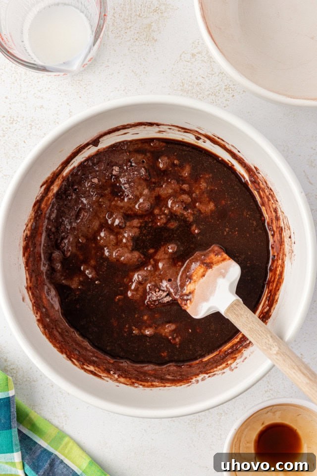 overhead view of coffee added to chocolate cupcake batter