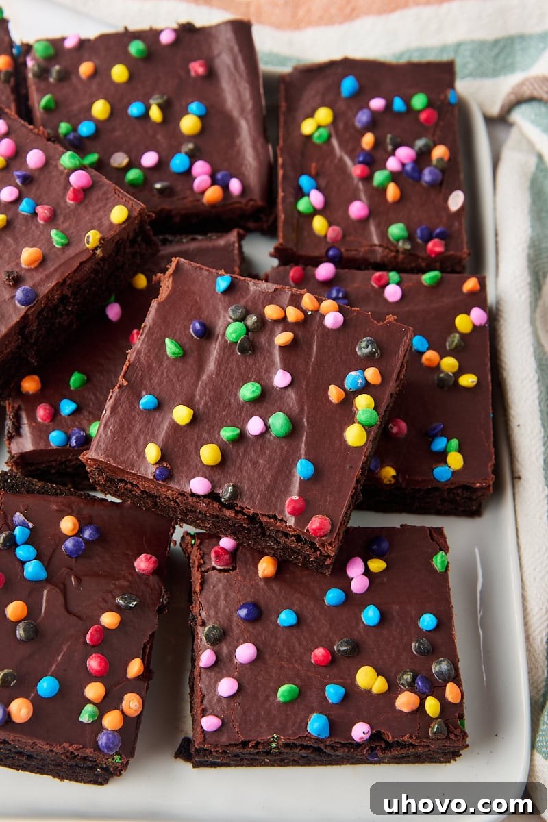 cosmic brownies in a stacked pile on a white serving plate
