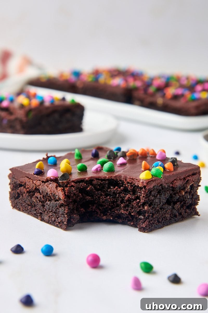 a cosmic brownie with a bite missing, with more brownies in the background