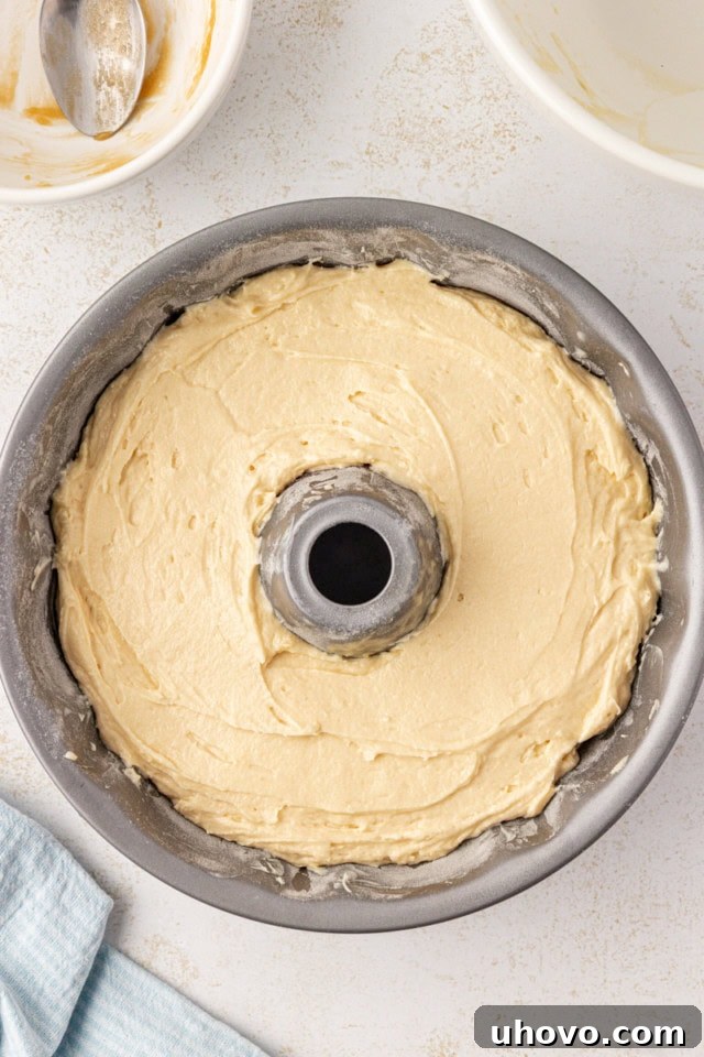 overhead view of caramel swirl Bundt cake in a Bundt pan ready to go into the oven