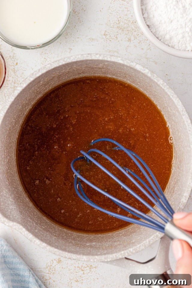 overhead view of butter and brown sugar melted together in a saucepan