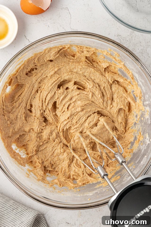 overhead view of graham cake batter in a glass mixing bowl