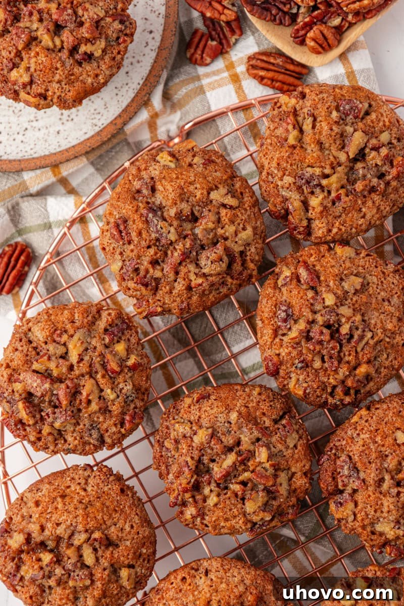 overhead view of several pecan praline muffins cooling on a wire rack