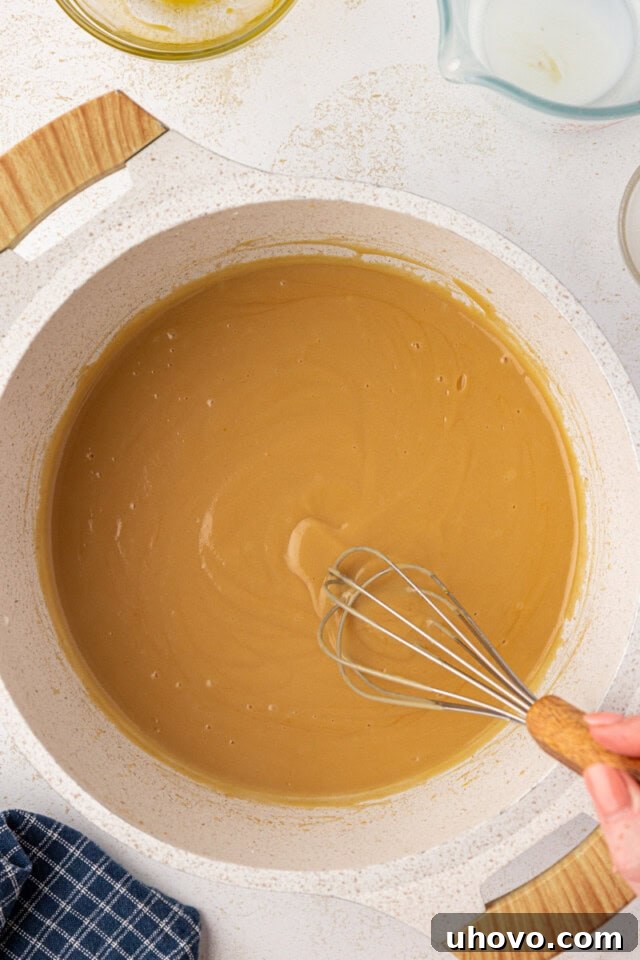 overhead view of butterscotch pie filling in a saucepan