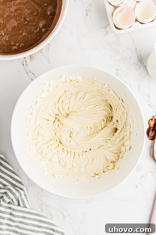 Overhead view of Irish cream flavored cream cheese in mixing bowl, perfectly smooth.