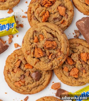 overhead view of Butterfinger cookies scattered on a white surface
