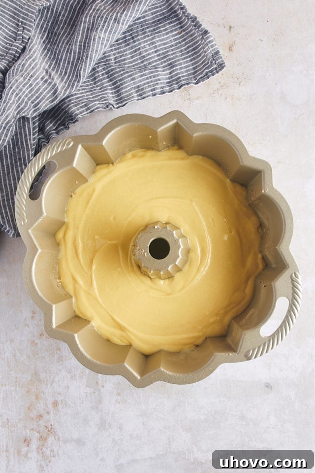 Overhead view of the rum cake batter in the Bundt pan, ready for baking.