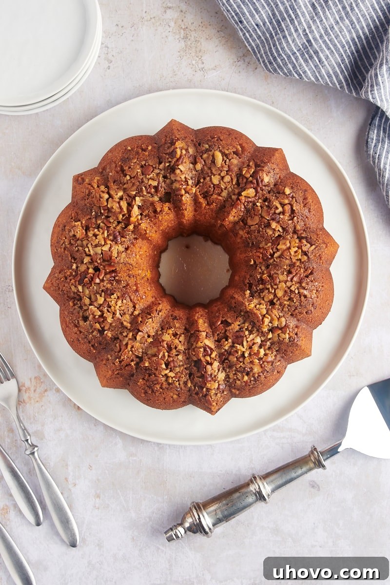Overhead view of a beautifully glazed whole rum cake, ready for serving.