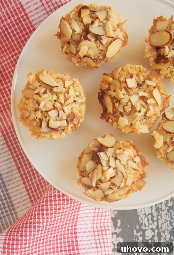 Close-up of Raspberry Almond Tarts baking, showcasing the golden crust and bubbling filling.