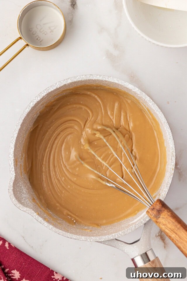 overhead view of brown sugar caramel frosting in a saucepan