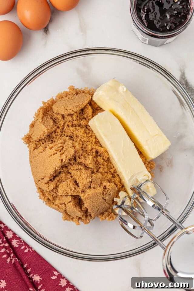 overhead view of butter and brown sugar in a glass mixing bowl