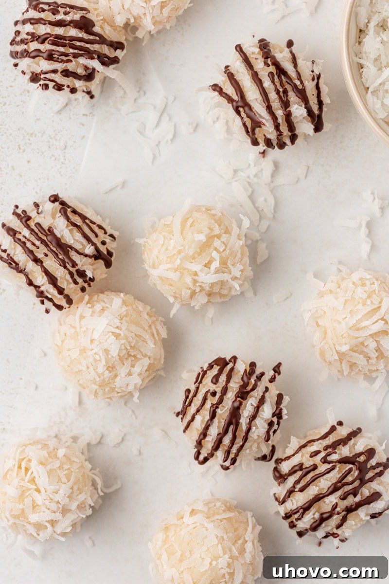 overhead view of coconut snowballs, with some drizzled with chocolate