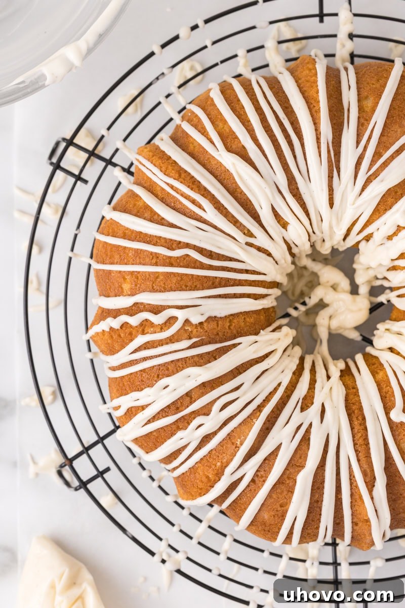 overhead view of vanilla Bundt cake finished with a smooth vanilla glaze