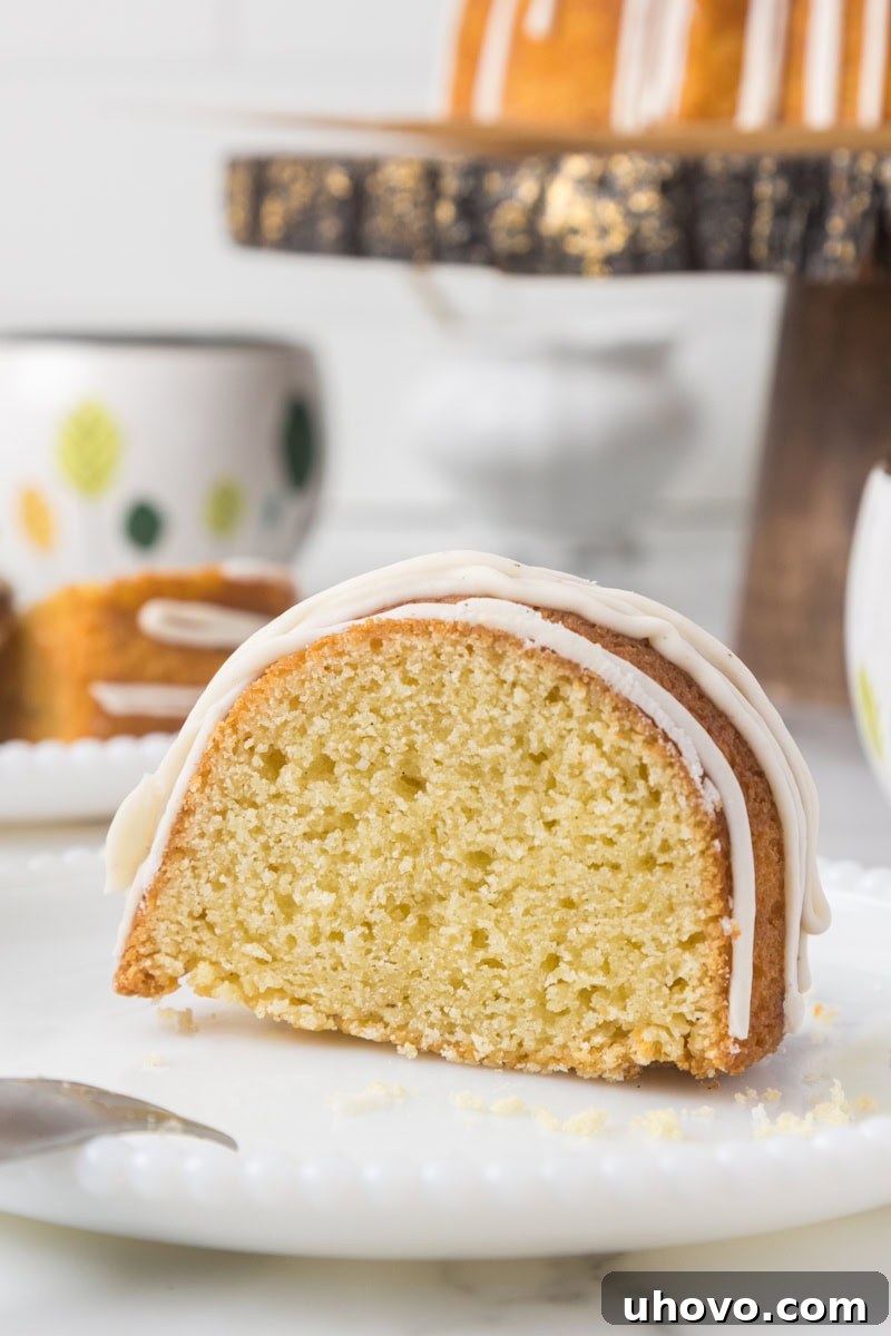 a slice of vanilla Bundt cake on a white plate