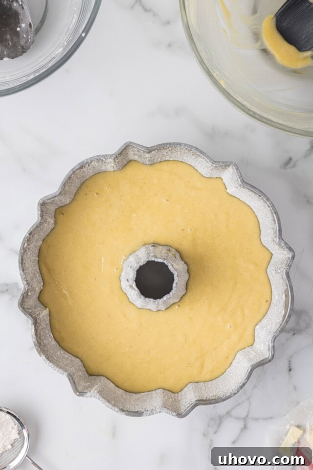 overhead view of vanilla Bundt cake in a Bundt pan ready to go into the oven