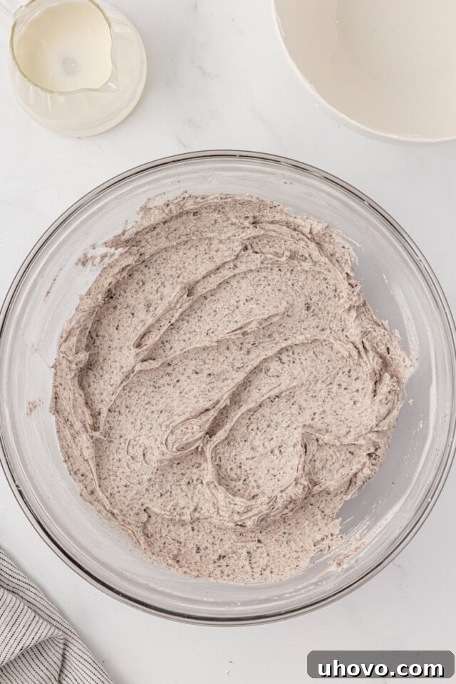 overhead view of Oreo buttercream in a glass mixing bowl