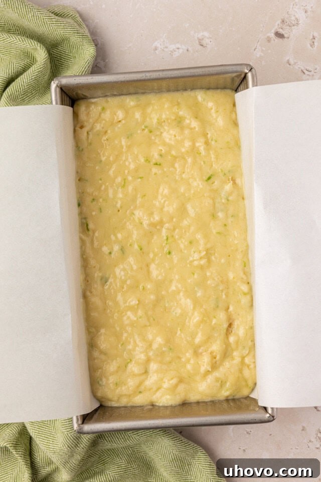 Batter for coconut lime loaf cake in loaf pan before baking
