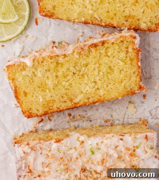 Coconut lime loaf cake sliced to show soft texture
