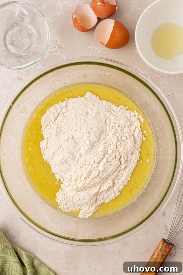 Dry ingredients added to wet ingredients for coconut lime cake