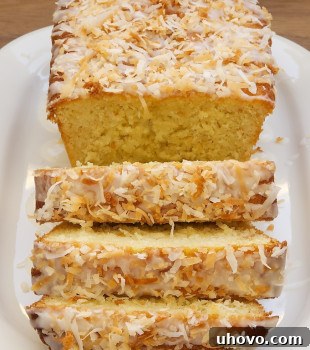 Sliced Coconut Buttermilk Pound Cake on white plate