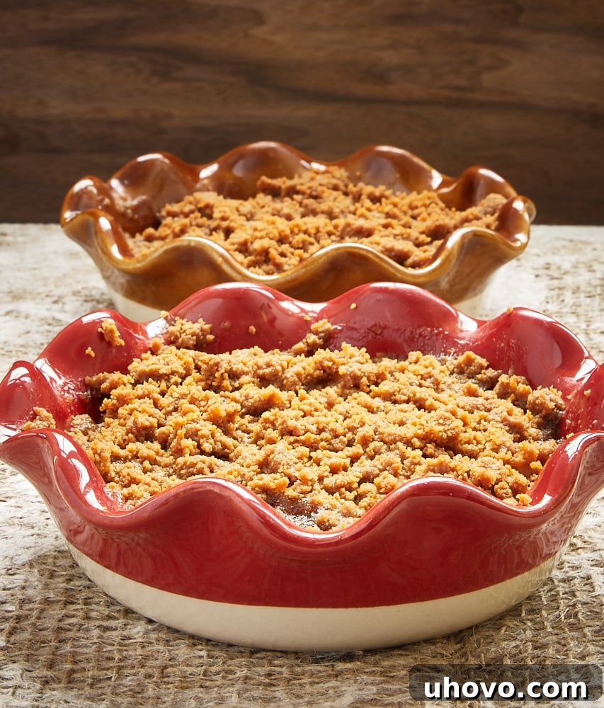 Apple Pear Biscoff Crisps in individual baking dishes, perfectly golden and inviting.