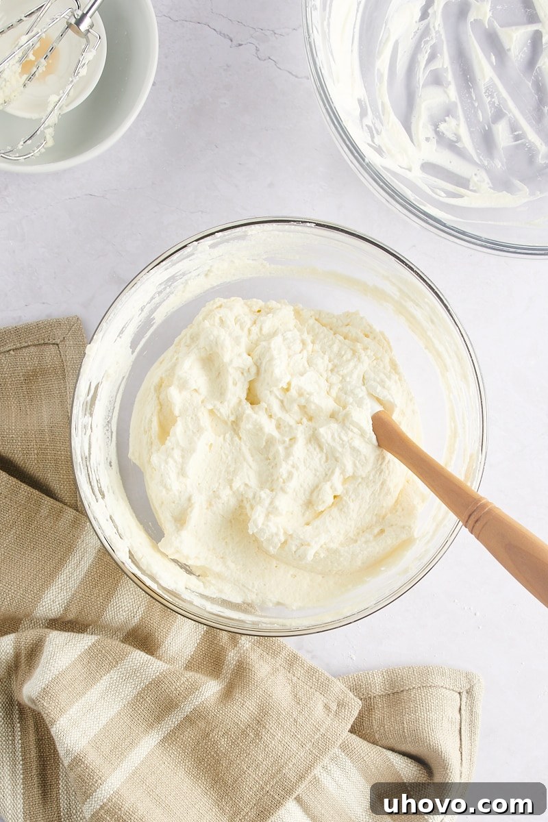 Finished mascarpone frosting in a mixing bowl, ready to be spread.