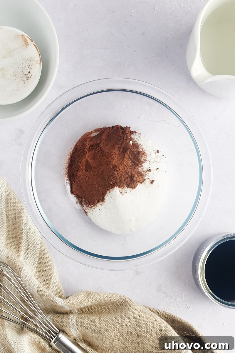 Overhead view of espresso powder and sugar in a bowl, ready to be mixed.