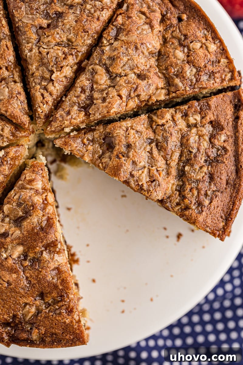 Overhead view of a freshly baked apple streusel coffee cake, artfully cut into individual serving pieces