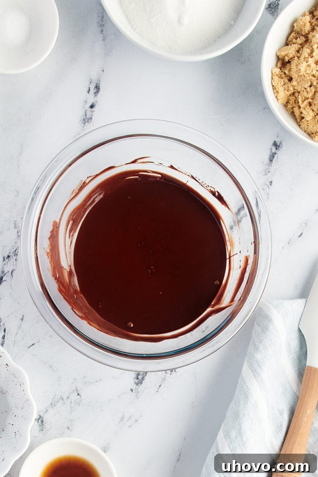 Overhead view of melted chocolate in glass bowl