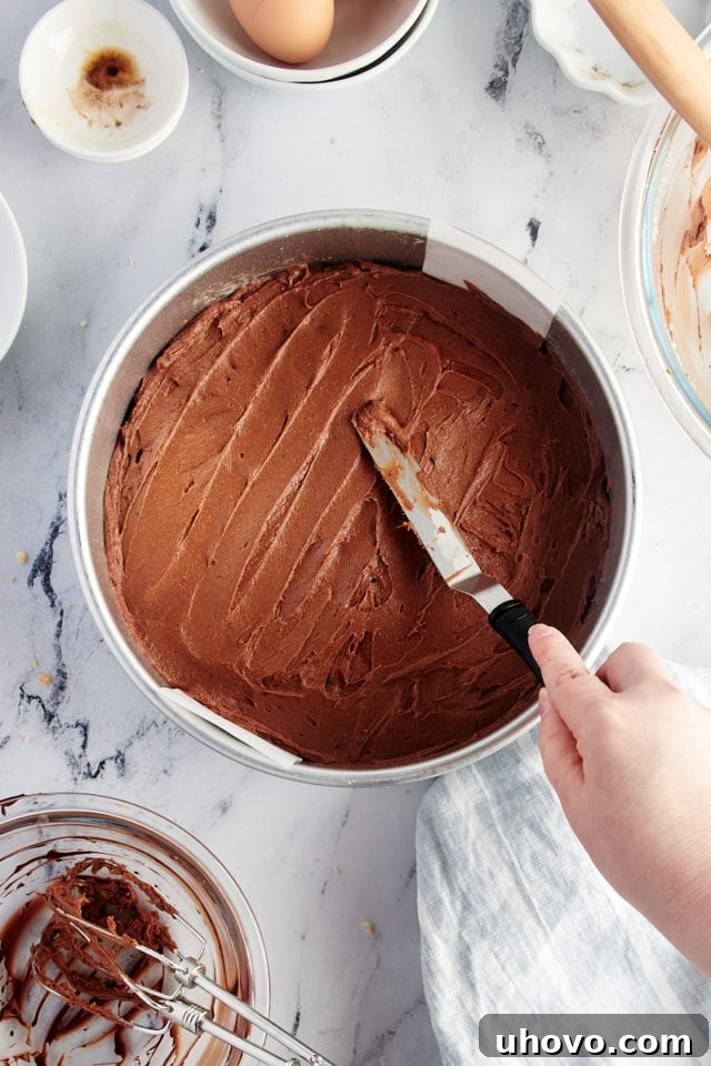 Spreading brownie batter into round pan
