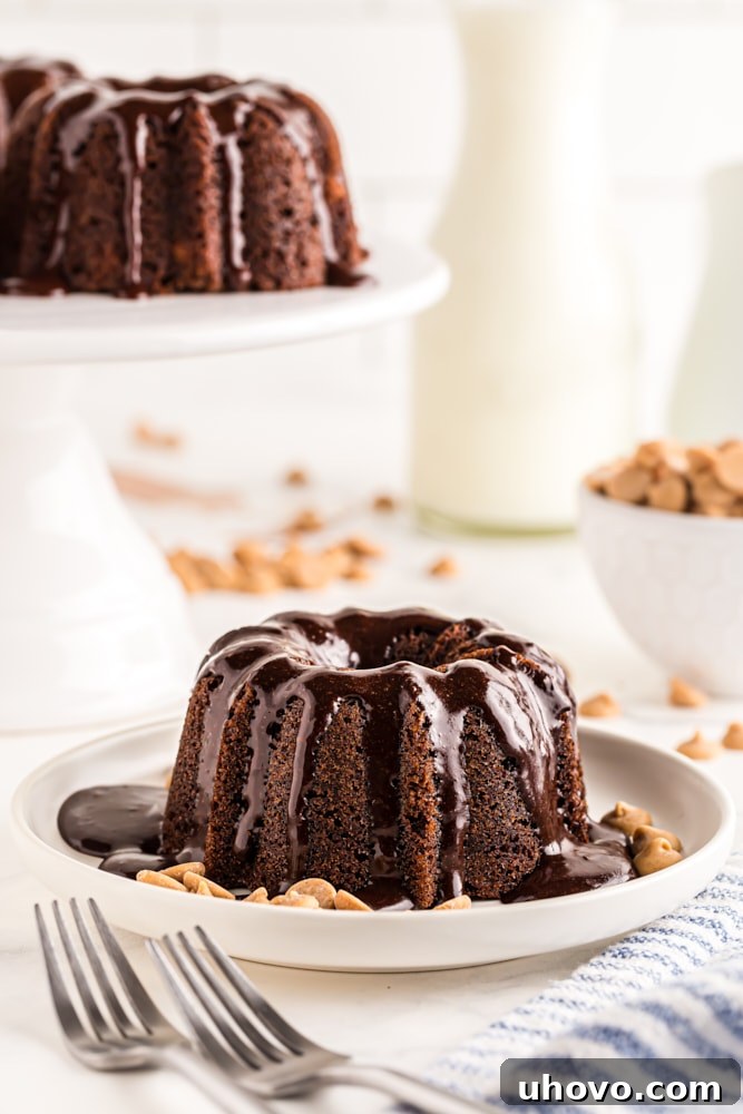 Mini Chocolate Bundt Cake on a white plate with a fork