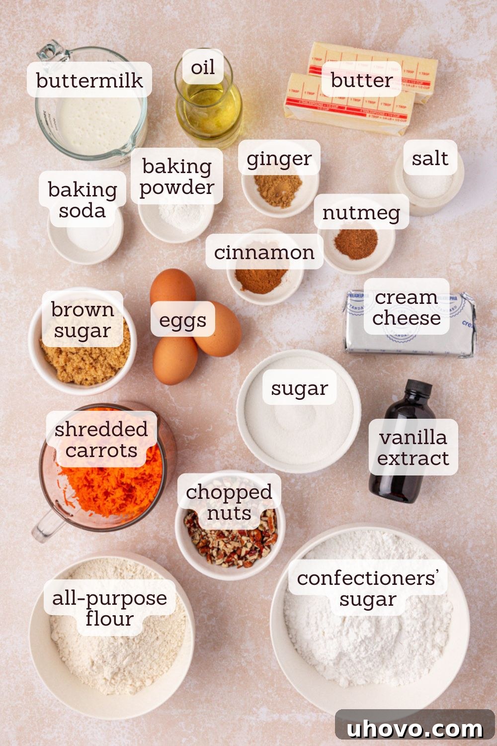 An overhead view showcasing all the essential ingredients for making carrot sheet cake with browned butter cream cheese frosting, neatly arranged for preparation.