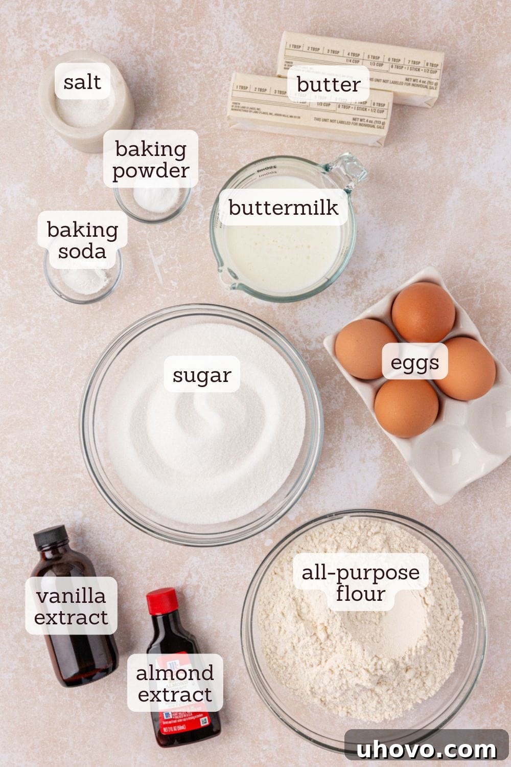 Overhead view of various ingredients meticulously arranged on a countertop, ready for making buttermilk pound cake.