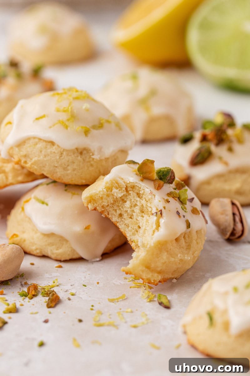 an Italian ricotta cookie with a bite missing, showcasing its soft interior