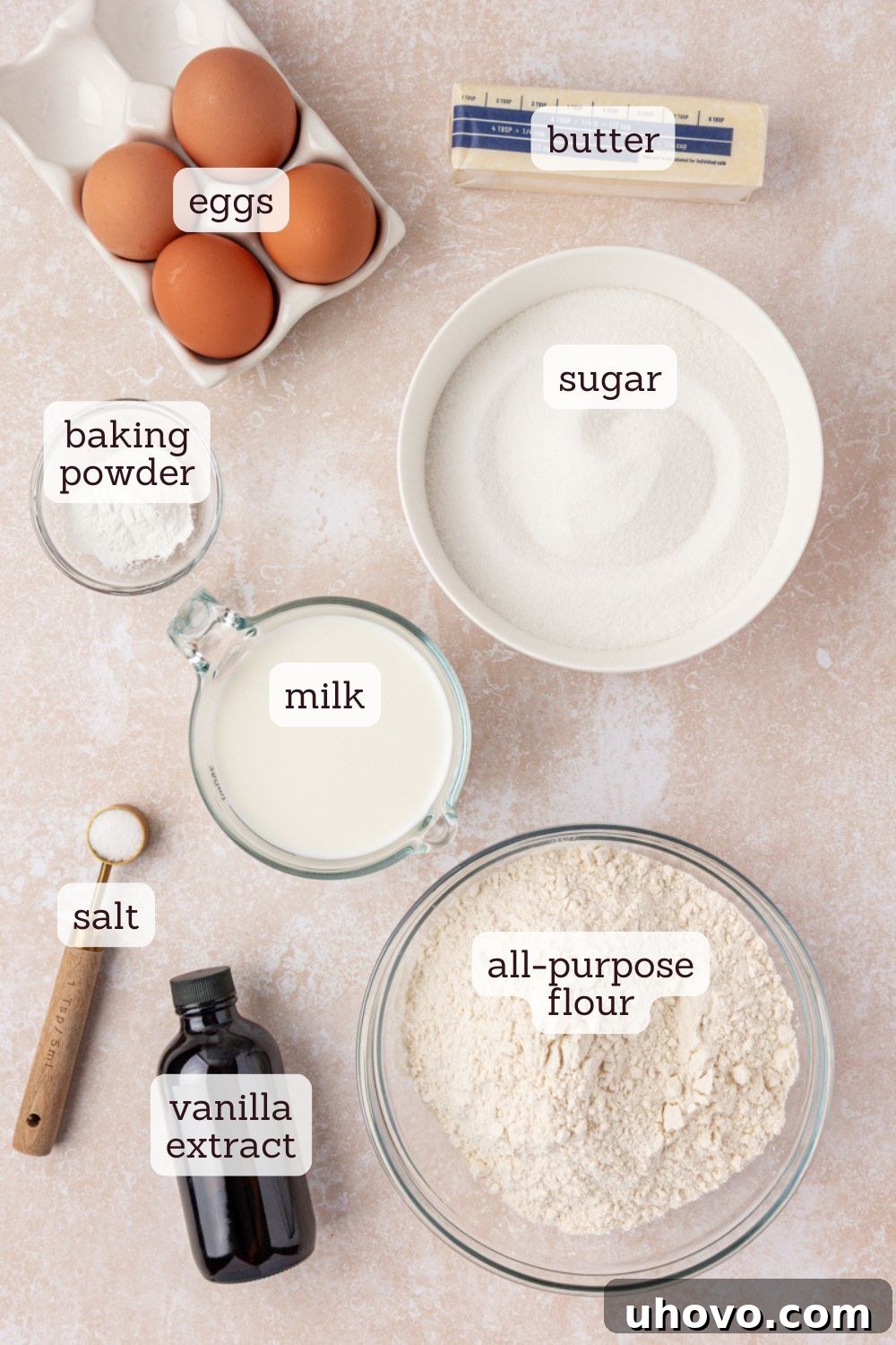 An overhead view showcasing all the simple, fresh ingredients meticulously laid out for baking the hot milk cake recipe, ready for preparation.