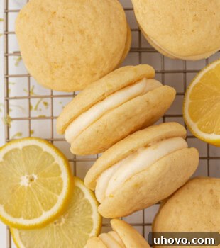 Soft lemon whoopie pies with a creamy lemon filling stacked elegantly.